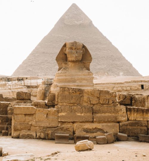 Iconic view of the Sphinx with the Pyramid of Khafre in Giza, Egypt.