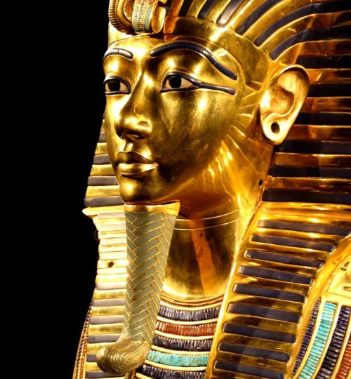 Close-up of Tutankhamun's gilded death mask showcasing intricate design.